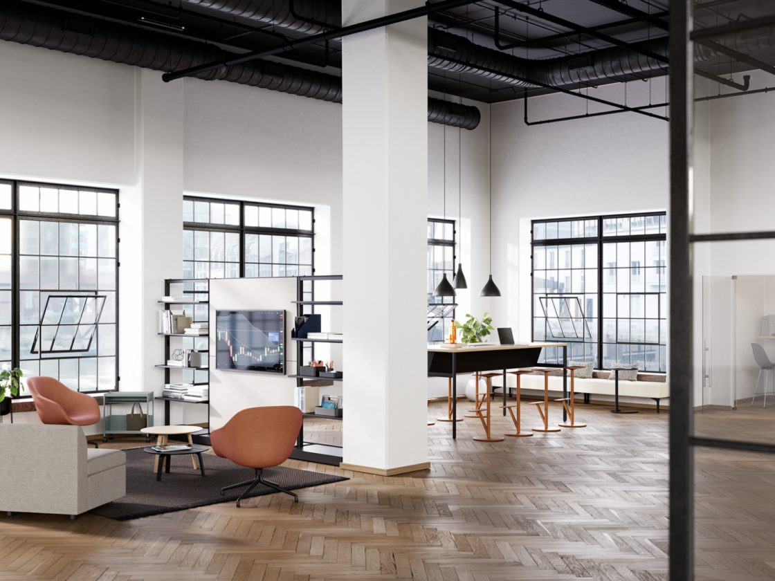 A lounge area featuring the OE1 Storage Trolley, OE1 Agile Wall, OE1 Communal Table, and the OE1 Micro Pack.