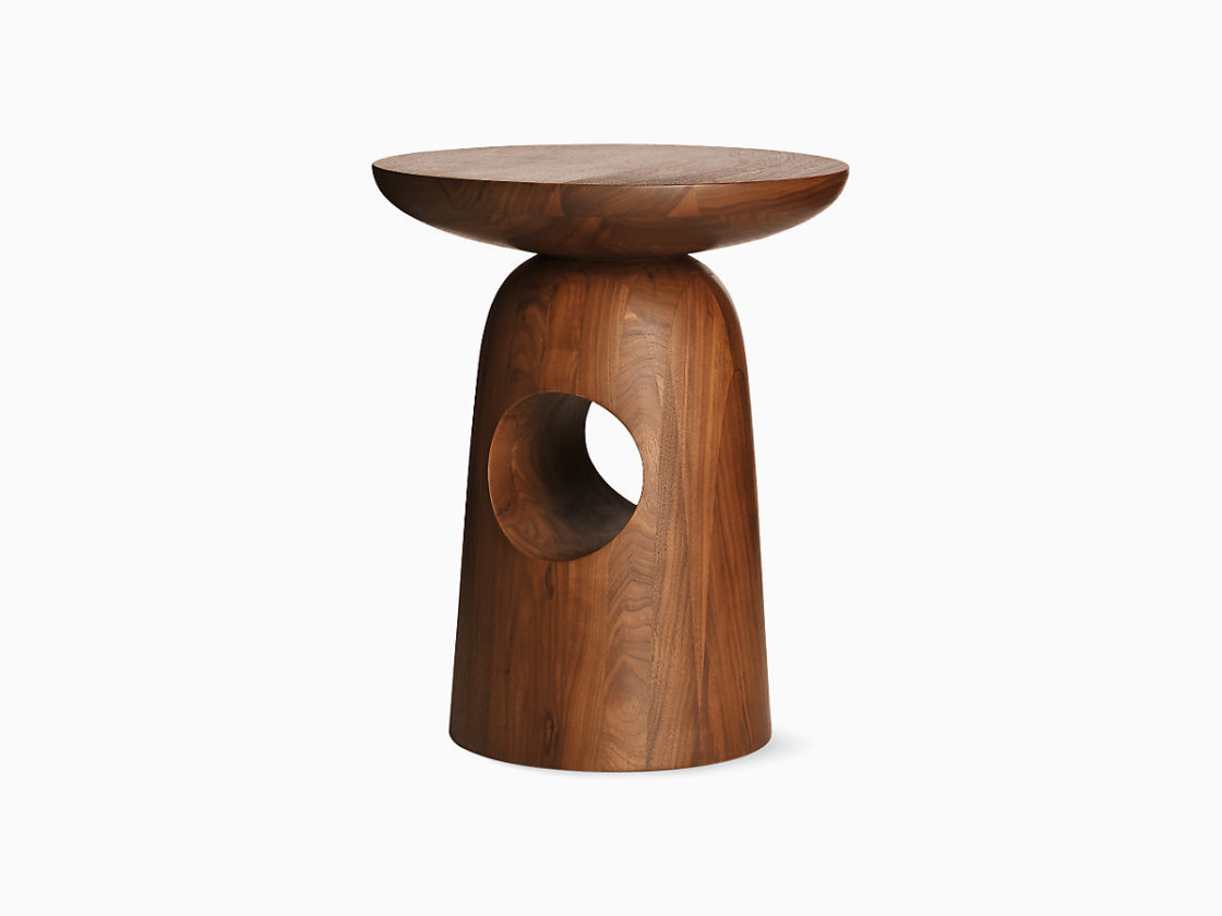 An image of Hew Shape E which is a solid wood figure with a shallow bowl shaped top on top of a rounded cone shape with a hole in its middle.