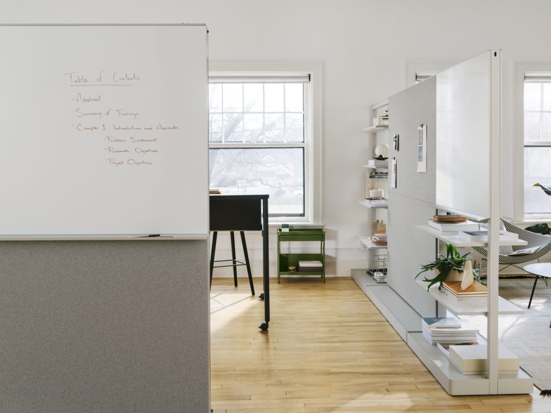 Multiple Agile Walls with different configurations enclosing a work space and providing privacy.