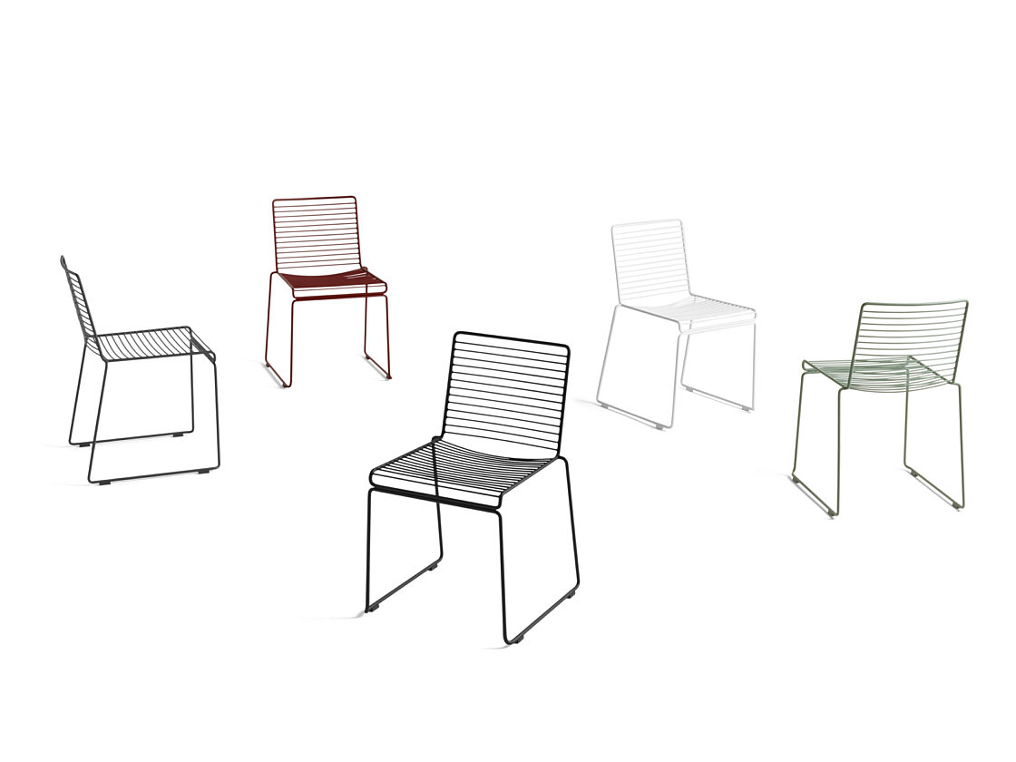 A collection of HAY Hee Dining Chairs in different colors - black, white, green, red, and navy - on a white background.