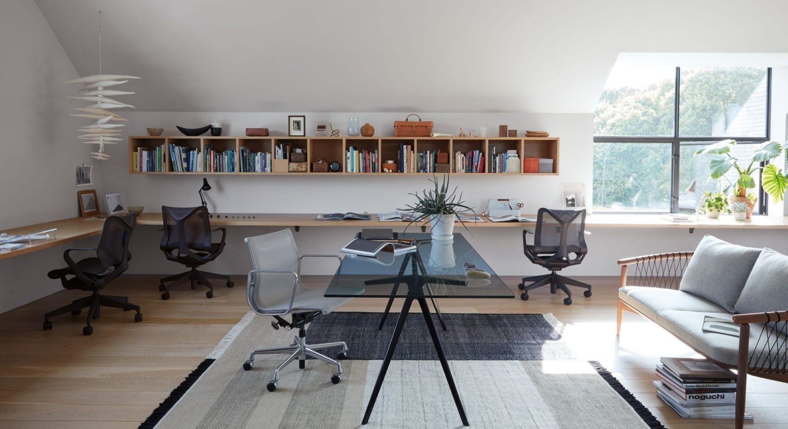 An image of a home office with Cosm chairs and a Geiger Crosshatch Sofa.