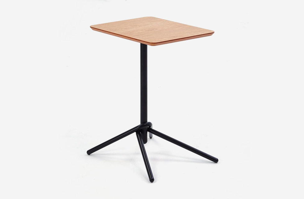 An image of a Knot Table with a black knotted base and a round wood top on a white background.
